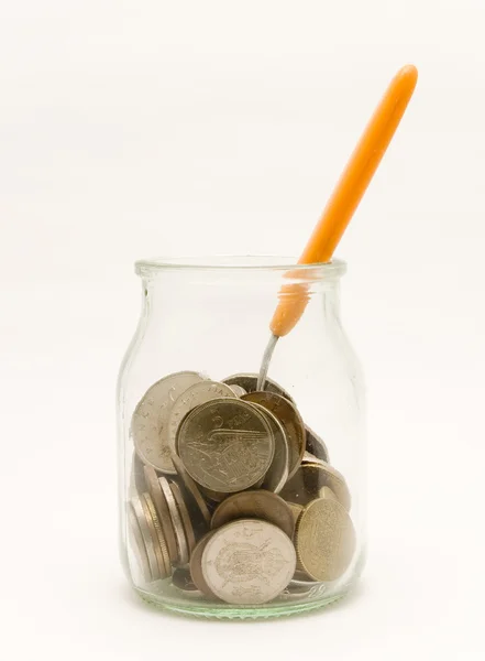 Yoghurt pot with coins — Stock Photo, Image