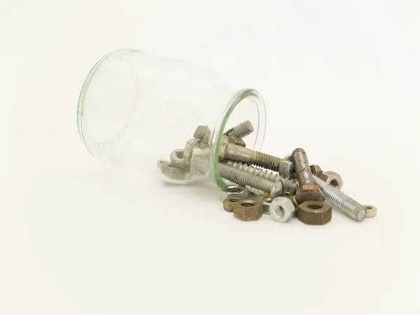 Bottle with screws — Stock Photo, Image