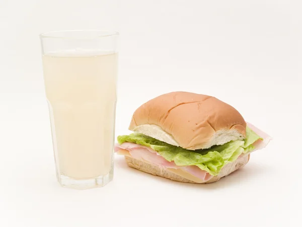 Sandwich and glass of grapefruit juice — Stock Photo, Image