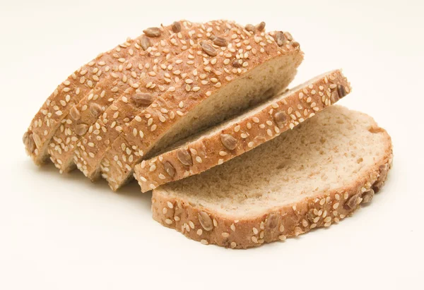 Slices of black bread, cereals — Stock Photo, Image