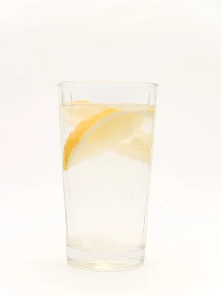 Glass of water and lemon — Stock Photo, Image