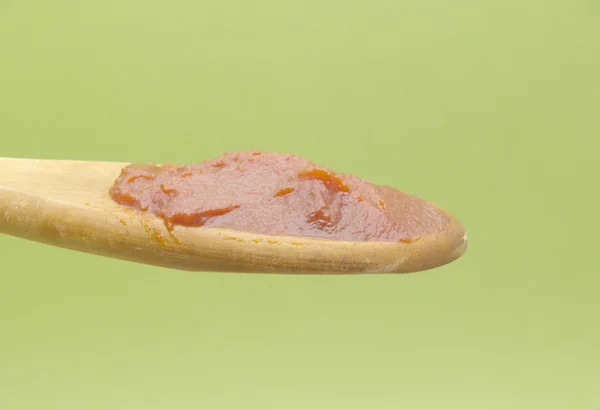 Spoon tomato paste — Stock Photo, Image