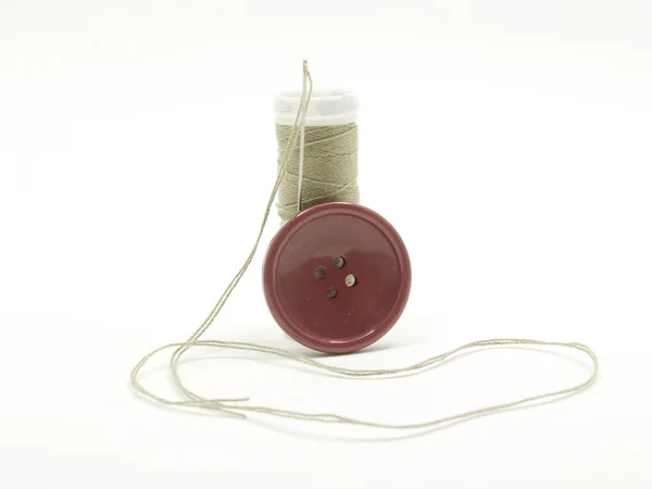 Sewing thread and button — Stock Photo, Image