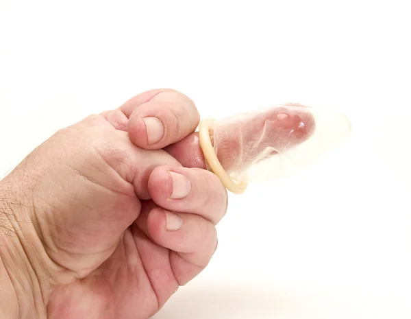 Condom in hand with your finger — ストック写真