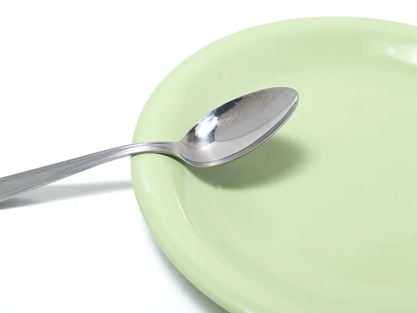 Piatto con cucchiaio — Foto Stock