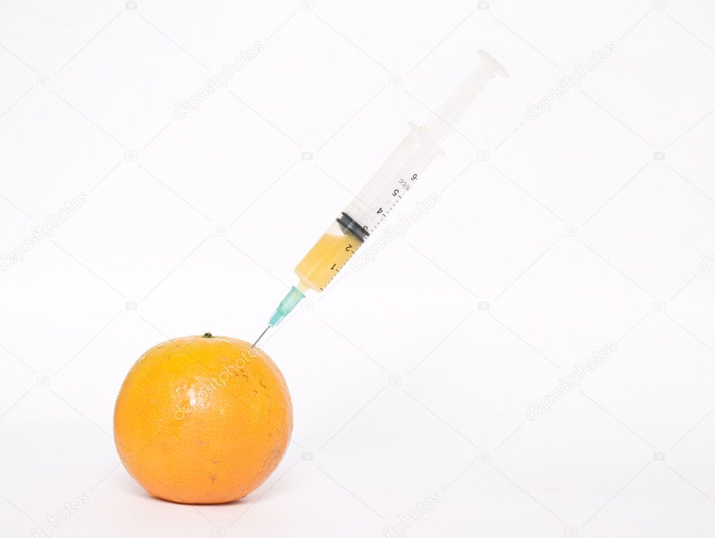 Orange with syringe