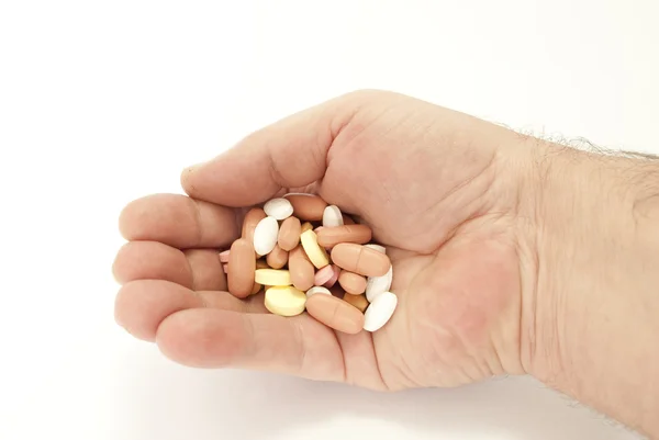 Mão com comprimidos — Fotografia de Stock