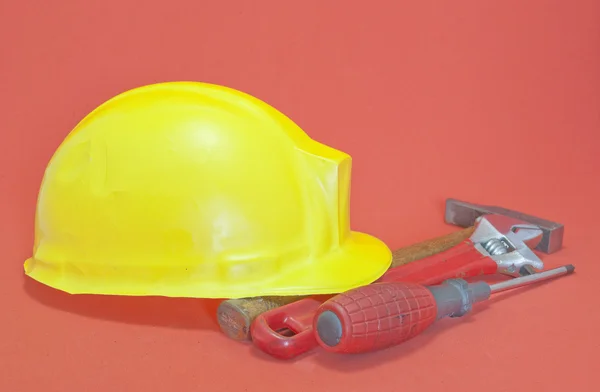 Yellow helmet and tools — Stock Photo, Image