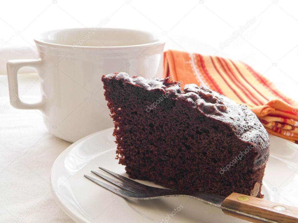 Chocolate Cake Slice on white dish.