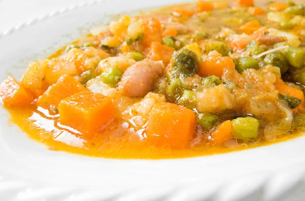 Vegetable soup on white dish. — Stock Photo, Image