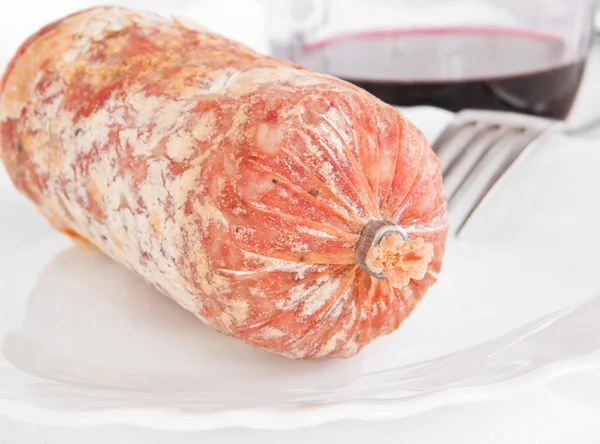 Salami with fork. — Stock Photo, Image