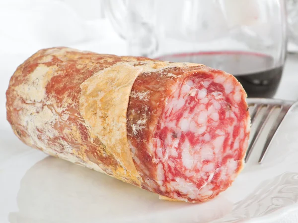 Stock image Salami with fork.