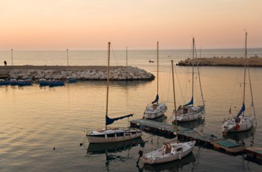 Touristic port of Giovinazzo at sunset. clipart