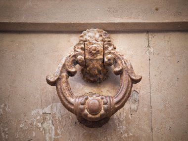 Ancient doorknocker. clipart