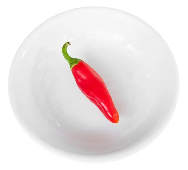 Red hot chili pepper on white dish. — Stock Photo, Image
