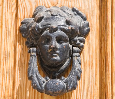 Ancient doorknocker. clipart