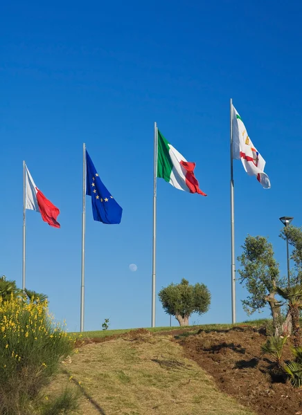 Flags on blue sky. — Stock Photo, Image