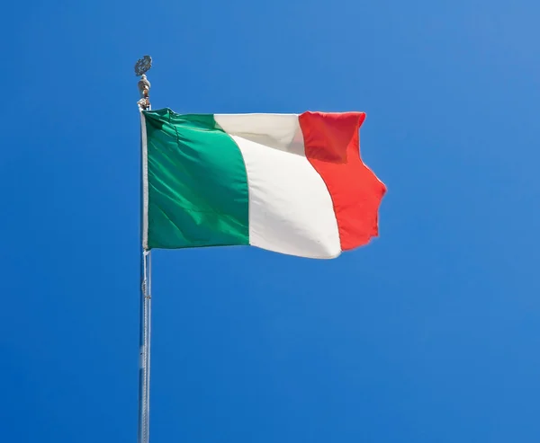 Italian flag on blue sky. — Stock Photo, Image