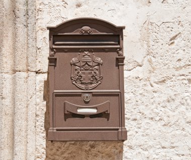 Brown Post box on wall. clipart