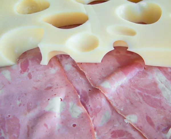 Cheese piece and mortadella slices. — Stock Photo, Image
