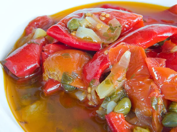 Stewed peppers on white dish. — Stock Photo, Image