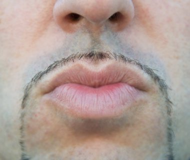 Close up of a man lips sending a kiss. clipart