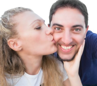 Woman kissing a smiling man. clipart