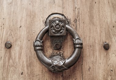 Doorknocker on allwood door. clipart