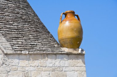 Close up of a terracotta water jug. Alberobello. Apulia. clipart