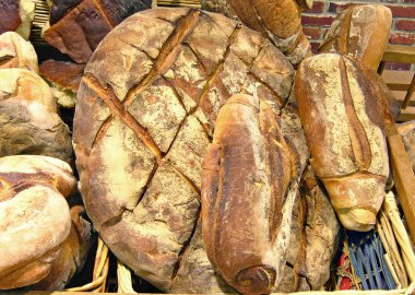 Sourdough breads in wicker basket. clipart