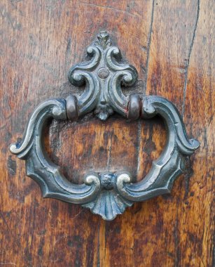 Doorknocker on allwood door. clipart