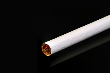 Cigarette isolated on black clipart