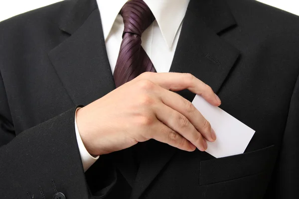 stock image Businessman holding blank card