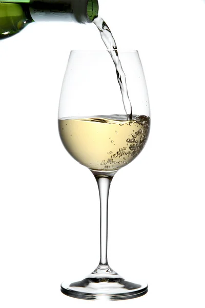 Pouring white wine Stock Image