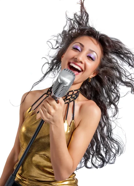 Woman singing into vintage microphon — Stock Photo, Image