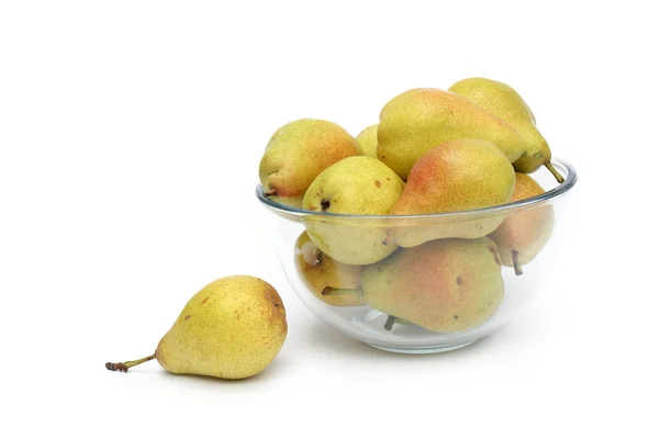 Yellow pears on glass dish with one pear aside — Stock Photo, Image