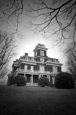 Victorian Mansion on a dark winter day. clipart