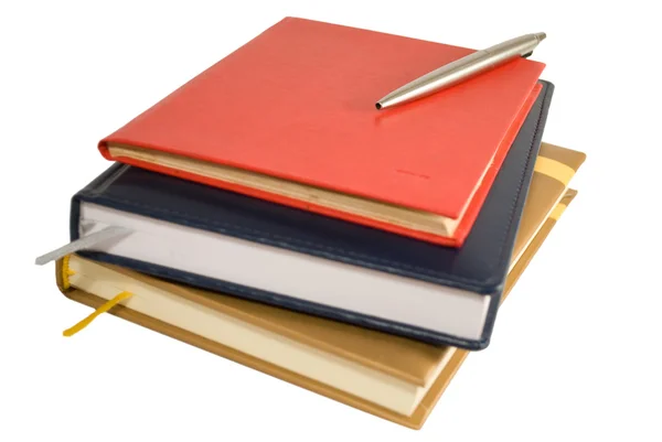 stock image Stack of books with notepad and pen