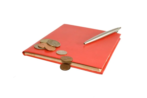 stock image Red notebook and steel pen with coins