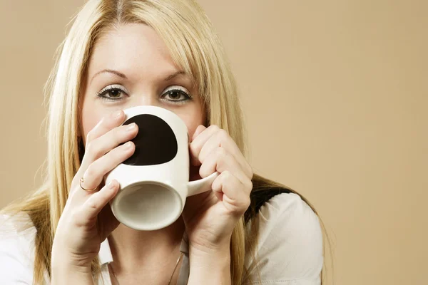 Drinking from a cup — Stock Photo, Image