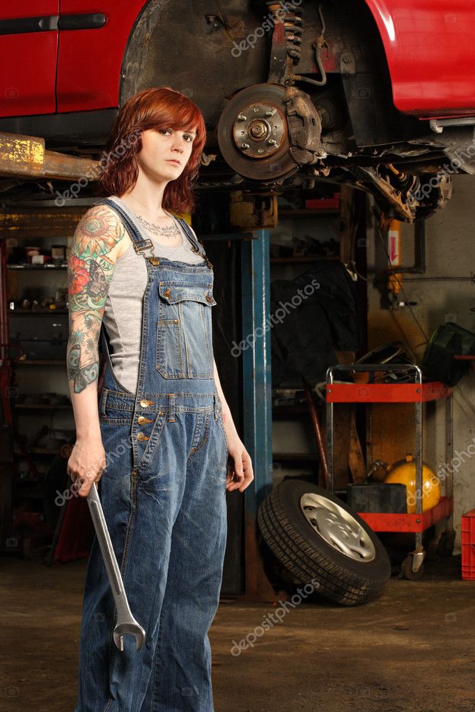 Mechanic Holds Nut Key Under the Car. Stock Photo - Image of mechanics,  repairman: 116449762