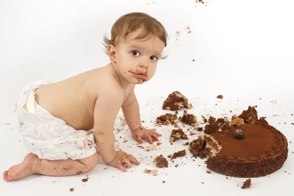 Baby eating chocolate cake — Stock Photo, Image