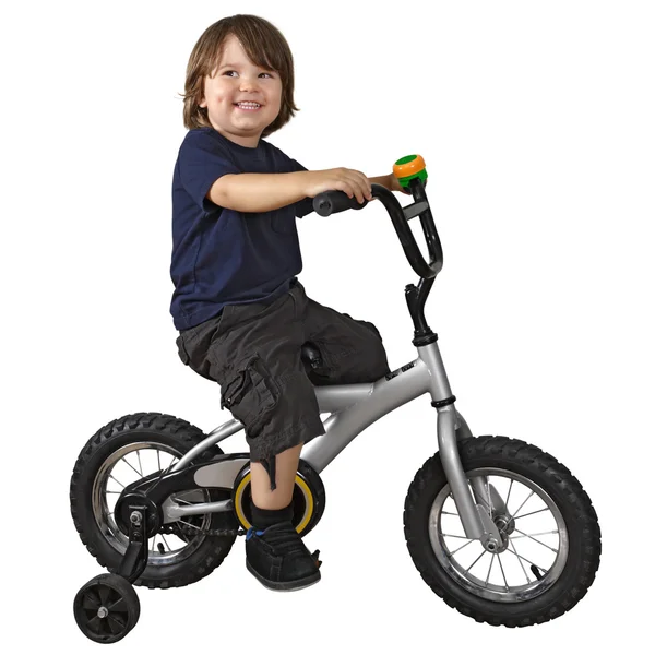 Милый мальчик на велосипеде — стоковое фото