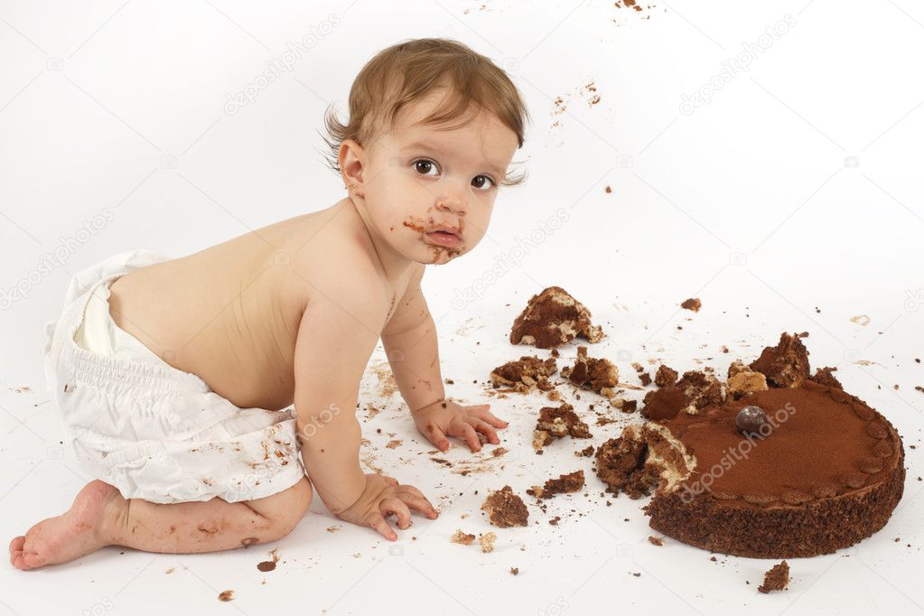 Baby eating chocolate cake