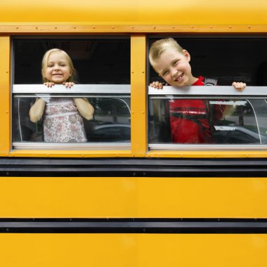 Children in a school bus clipart