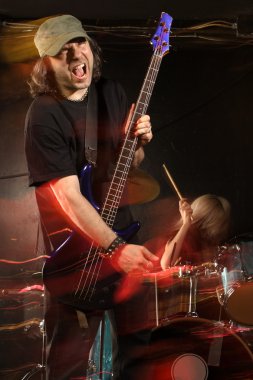 Bass guitar player on stage clipart