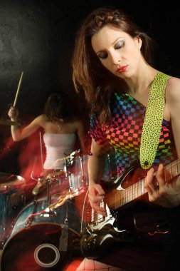 Woman playing electric guitar clipart