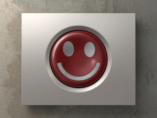 Красная кнопка со знаком улыбки — стоковое фото
