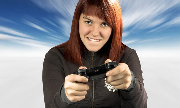 stock image Cute redhead playing video games in winter