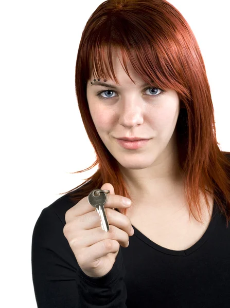 Cute redhead giving real estate key — Stock Photo, Image